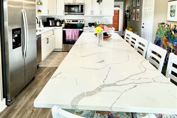 Counter extension with extra dining and work spaceSix padded counter stools