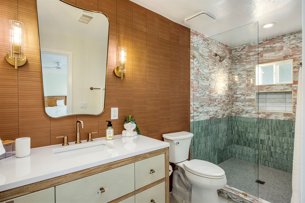 Sedona inspired breath taking marble tile, luxury alligator vanity, mood lighting to make getting ready feel like you are going to step on the red carpet. Hair dryer and Moroccan oil shampoo and conditioner in every bathroom.
