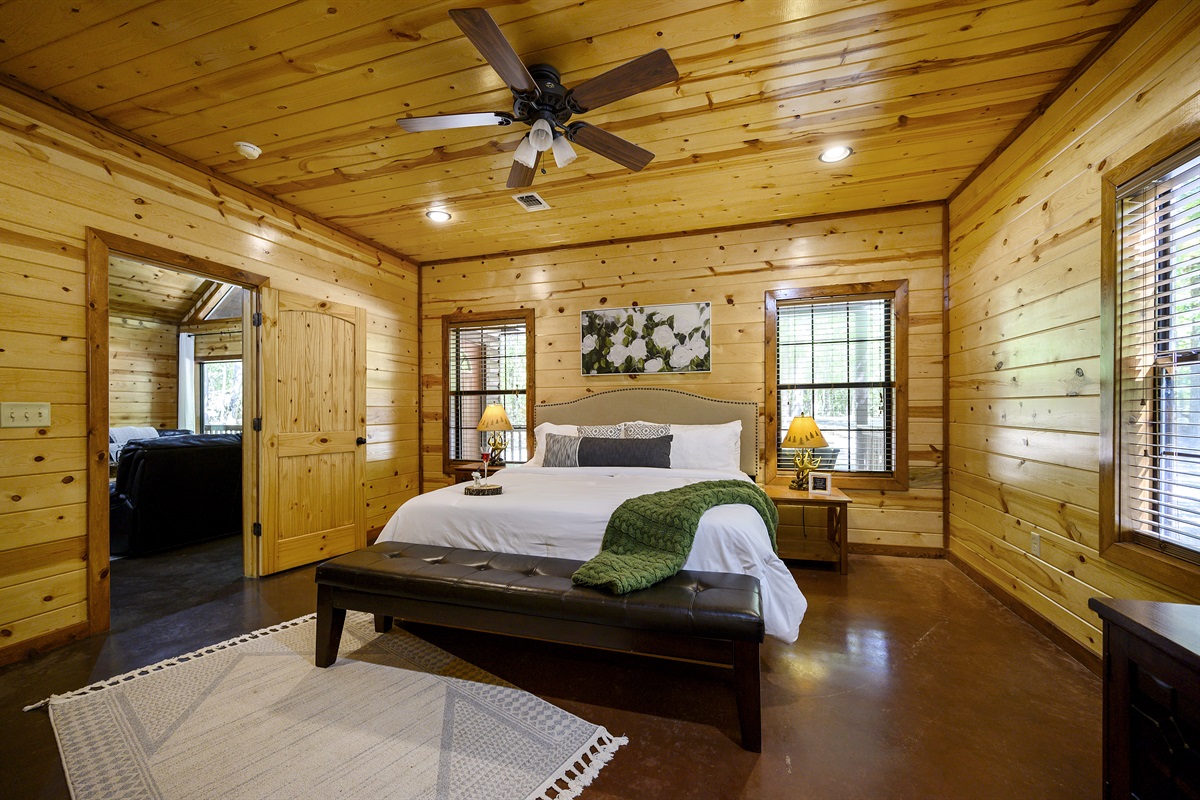 King suite provides cozy bedding, smart TV and closet space for storage.