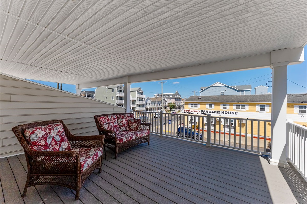 Private covered deck off of 2nd floor front bedroom with beautiful views of the ocean. 