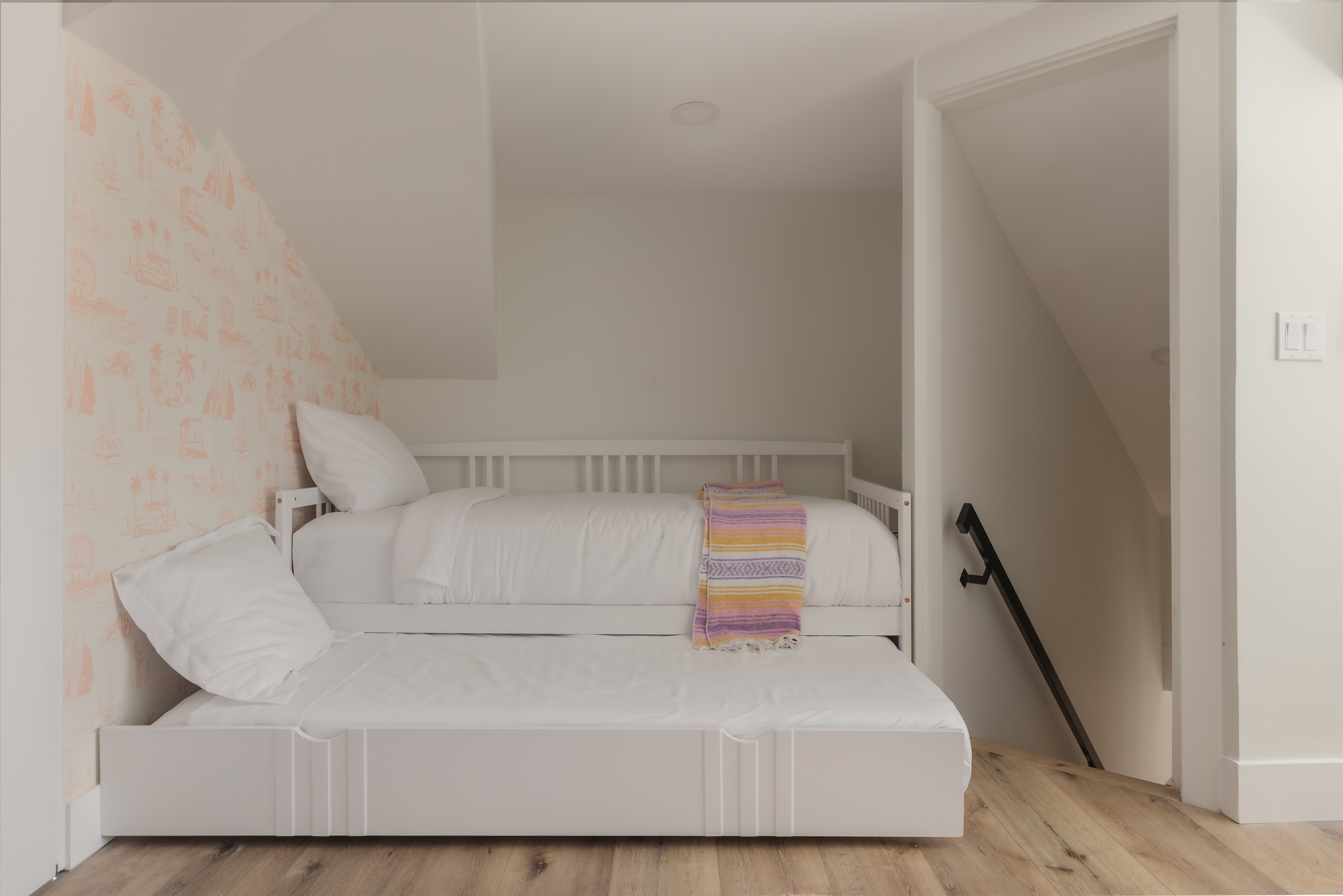 Tucked under the eaves and full of charm, this cozy corner is just one of the many little nests that inspired our name. Whether you're reading stories or sneaking in a nap, there's room for everyone to roost. 💤✨