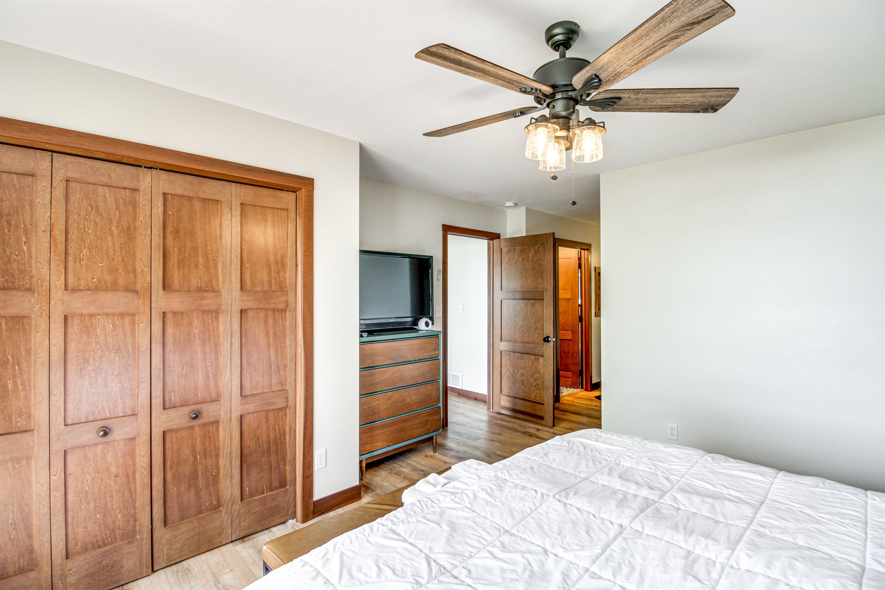 Spacious primary bedroom with closet storage and easy access to the main living area