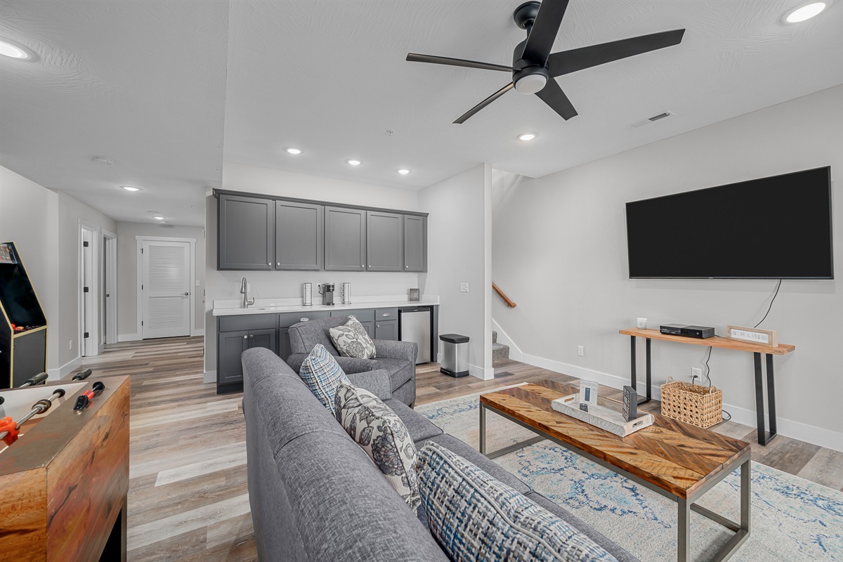 Lower living room with arcade machine & fooseball!