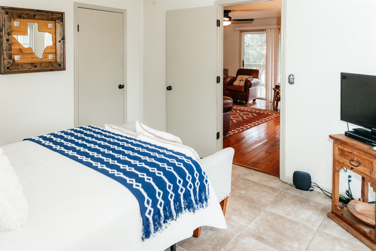 The downstairs bedroom connects to the living room and downstairs bathroom. TV is connected to DirectTVom