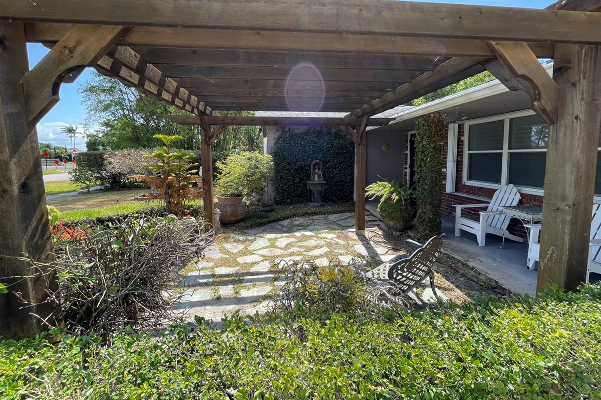 Enjoy time outside under the pergola, surrounded by a garden and fountains.