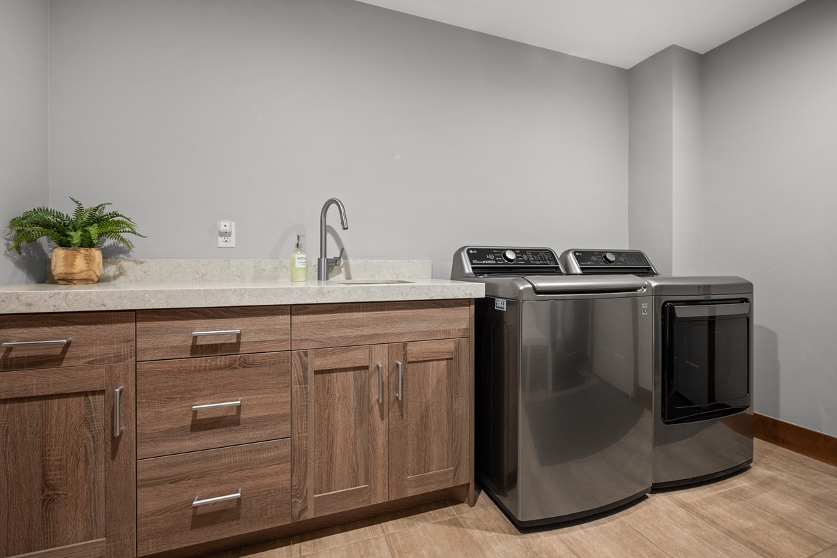 Laundry room with washer, dryer, and folding space
