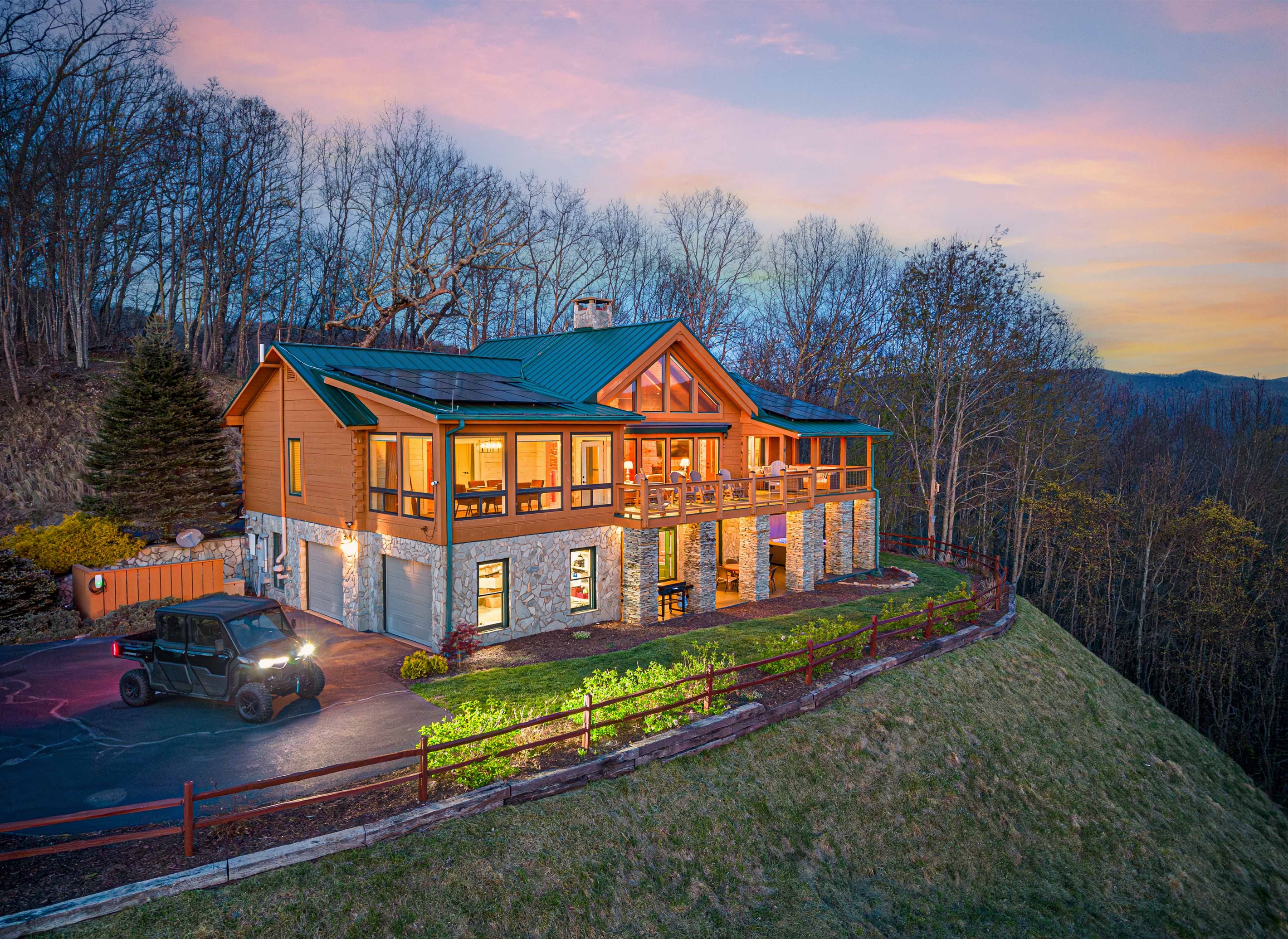 Exterior View: Marvel at stunning mountain sunsets from this inviting cabin retreat!