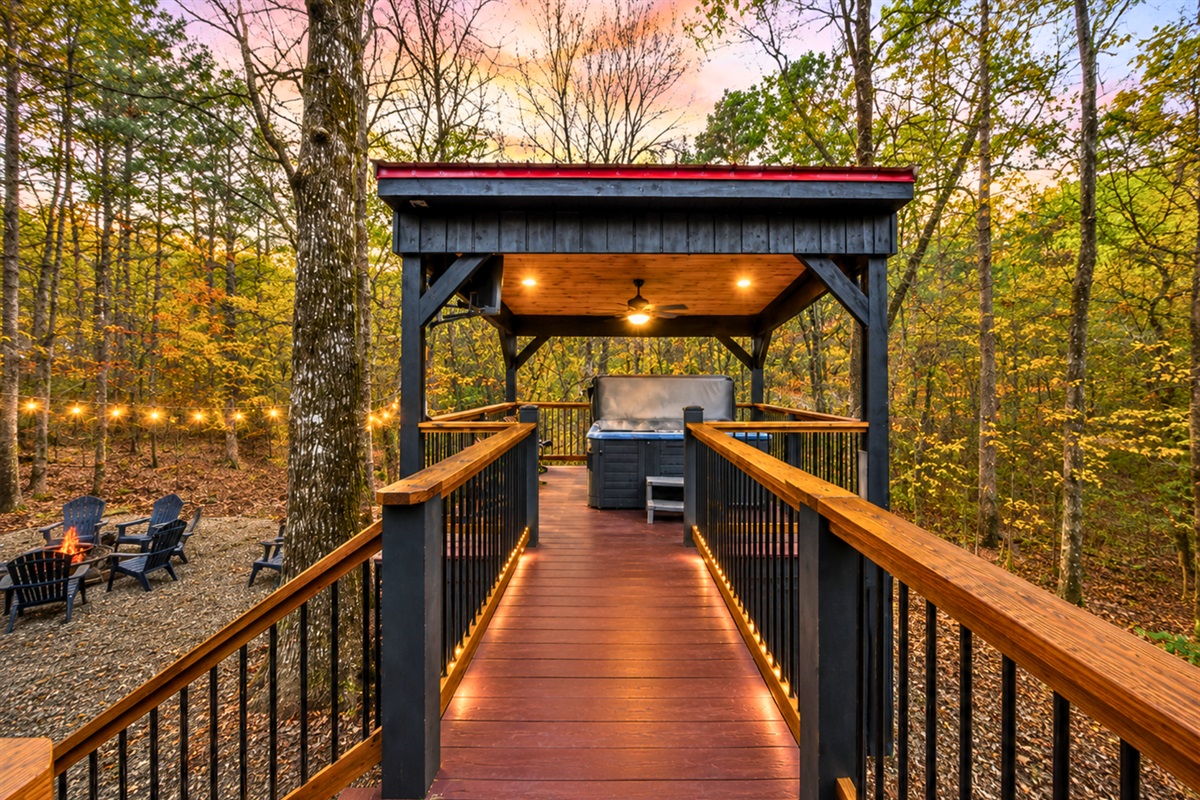Leading up to the home, the covered walkway creates a peaceful arrival experience tucked among the trees.