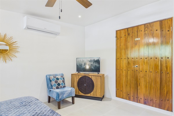 Bedroom 3.  Double doors that can be locked for privacy from bedroom 2.  If you lock these doors bedroom 3 has privacy and can only be accessed through it's own private entrance.  En suite bathroom.  AC. Smart tv.  King bed