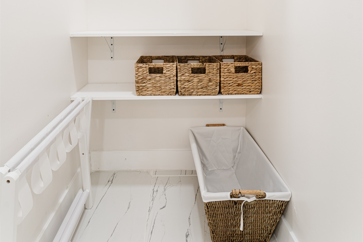 Primary king suite designed for rest and privacy, featuring fresh cotton linens, a Smart TV, and serene Palm Beach–inspired finishes. Includes a walk-in closet and private en-suite bathroom for a comfortable, hotel-style stay.