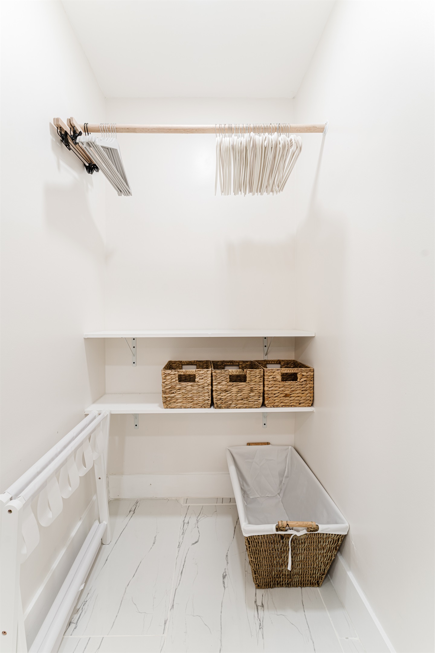 Primary king suite designed for rest and privacy, featuring fresh cotton linens, a Smart TV, and serene Palm Beach–inspired finishes. Includes a walk-in closet and private en-suite bathroom for a comfortable, hotel-style stay.