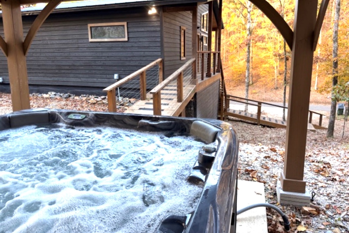 Your own secluded hot tub retreat, just steps from the cabin — warm, peaceful, and wrapped in nature