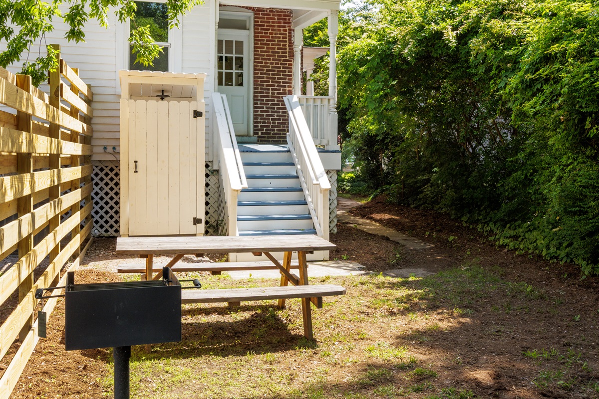 Shared backyard offers additional parking. A BBQ grill and outdoor seating have been recently installed behind the house on each side as well.