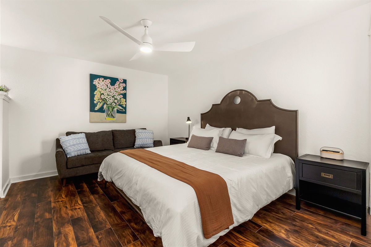 Another king bedroom with comfortable furnishings and natural light