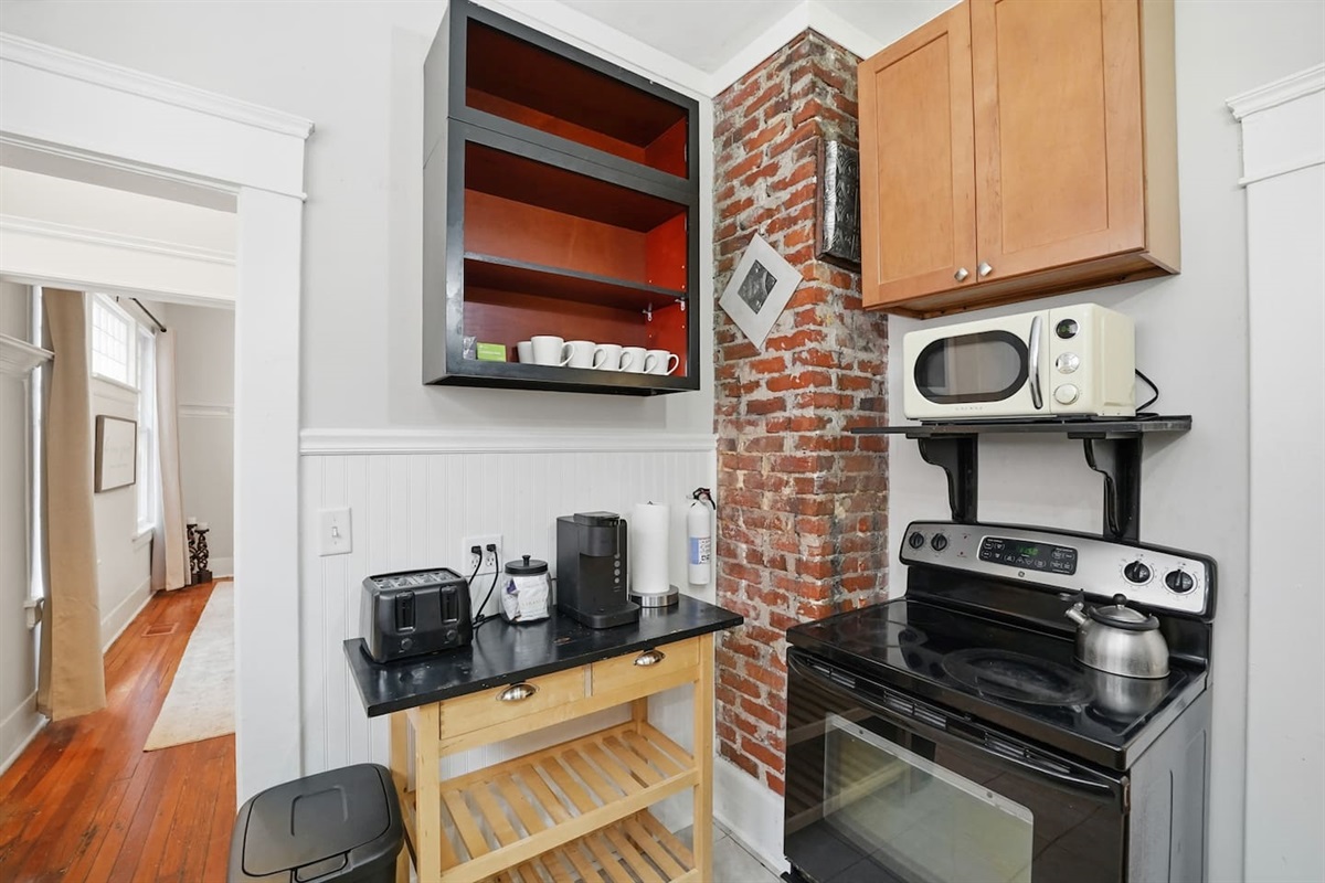 Kitchen with oven and microwave, and full coffee set