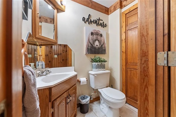 Upstairs half bath with sink and toilet