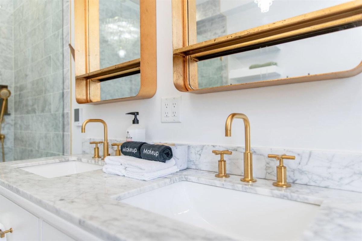 A bathroom sink with a contemporary design, featuring a smooth, minimalist countertop and an elegant faucet, blending both practicality and sophistication to enhance the overall bathroom aesthetic.