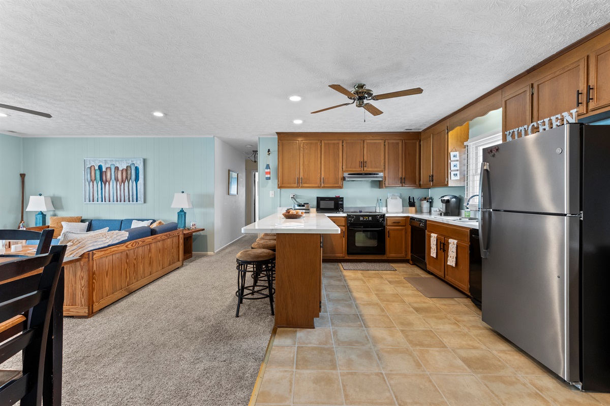 Kitchen & Living Area: Whip up culinary delights and unwind in this stylish, open layout!
