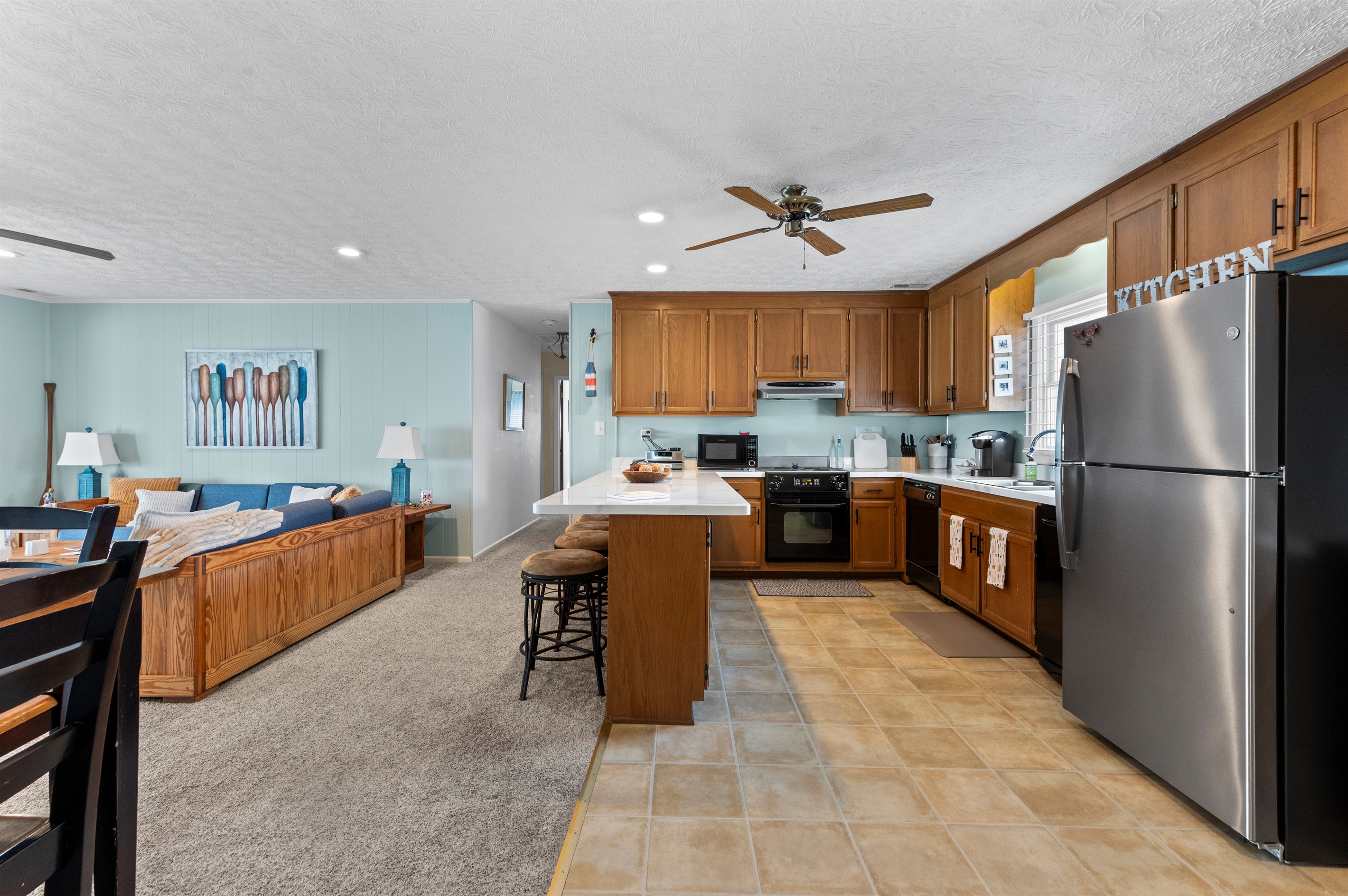 Kitchen & Living Area: Whip up culinary delights and unwind in this stylish, open layout!