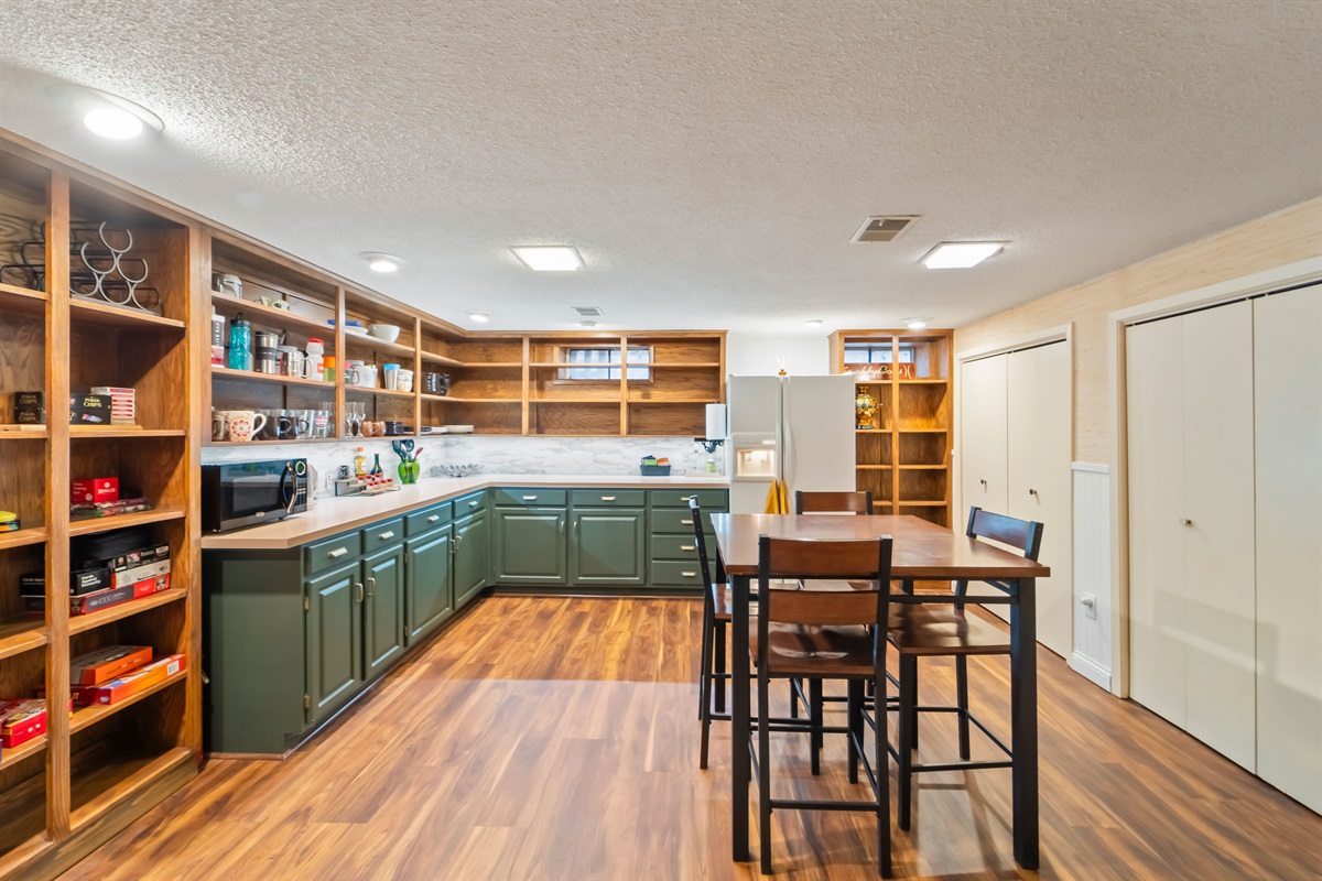 The downstairs kitchenette has plates, bowls, silverware, cooking utensils, plus extra fridge and freezer space, for larger family gatherings or for ease of living with multiple co-workers on a hitch. 