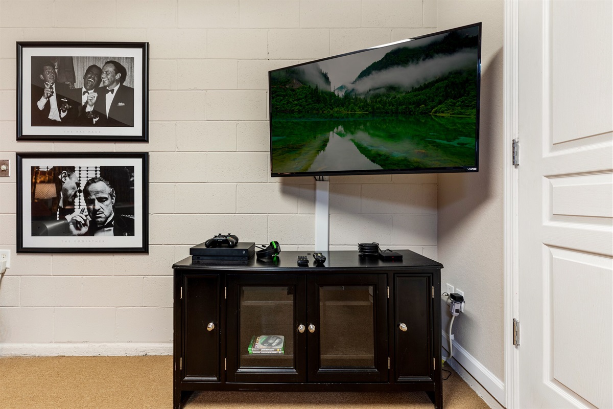 X Box and Flat screen TV in recreation room
