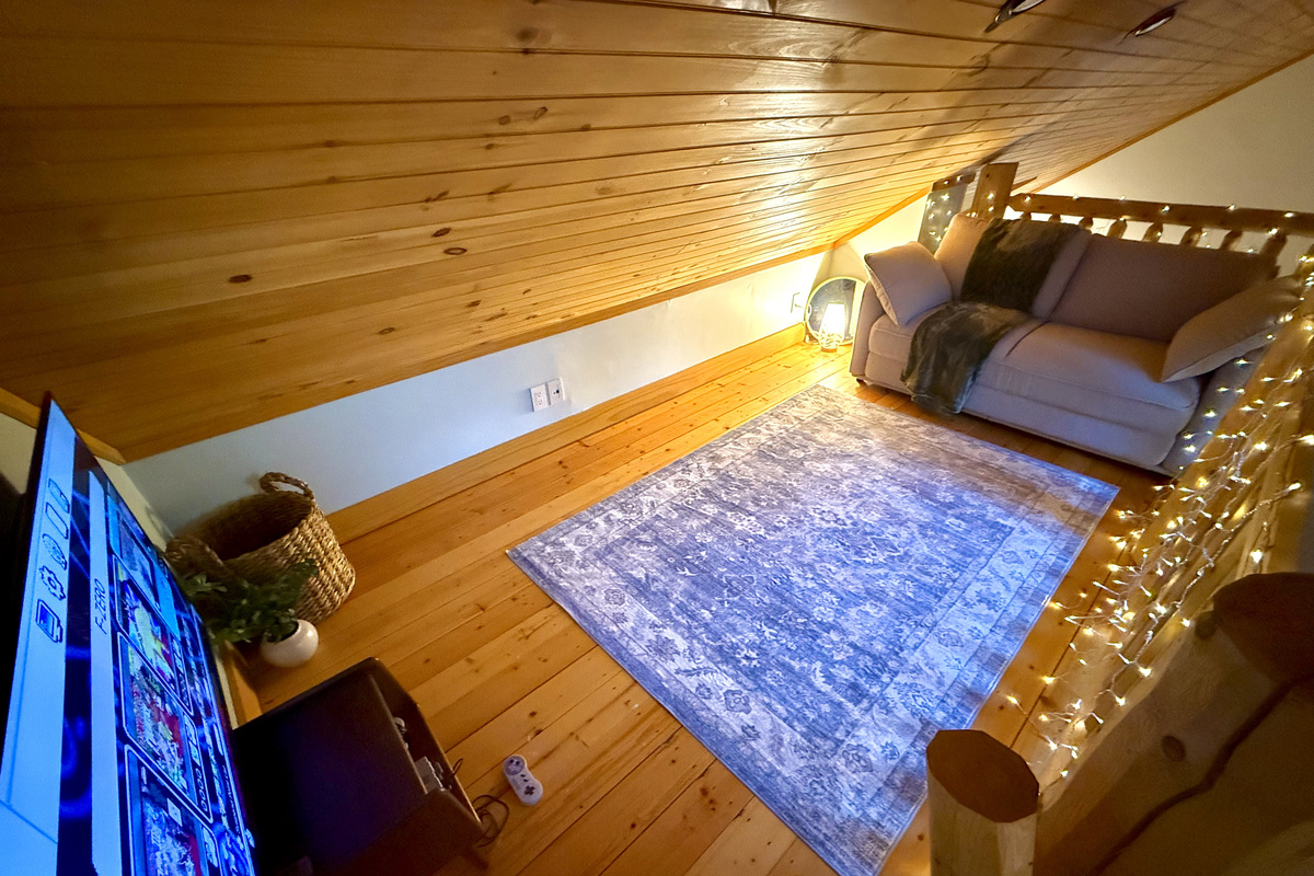 Fun loft hangout space with retro gaming system