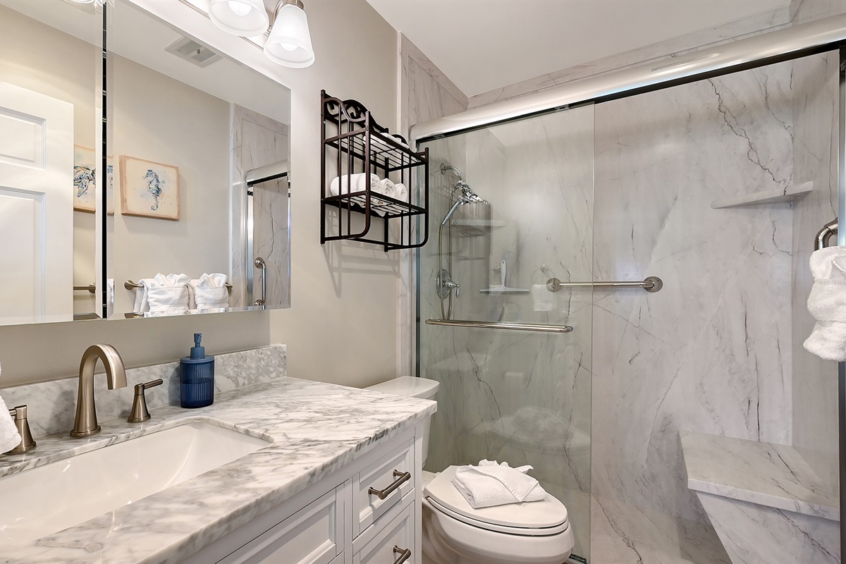 Master bath is ensuite and features a walk-in shower