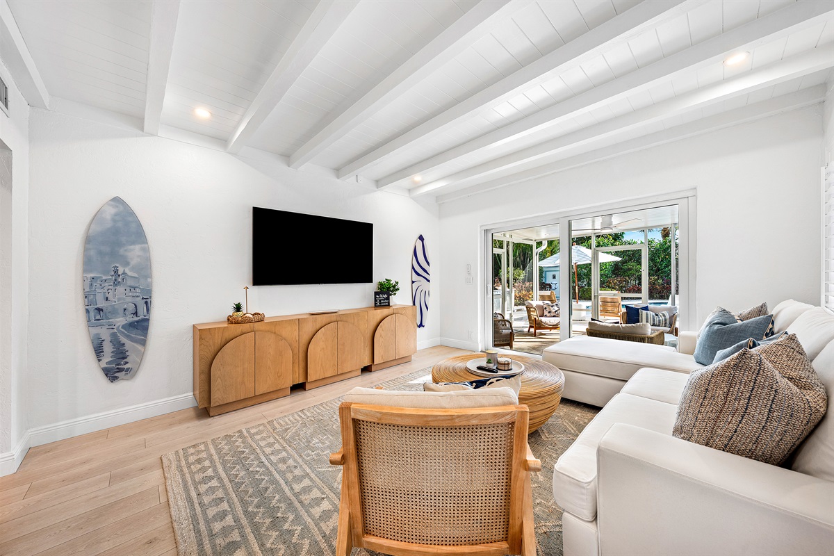 Entertainment ready! Enjoy your favorite shows on the large flat-screen TV in our cozy living room, complete with a surf-inspired vibe and comfortable sofa.