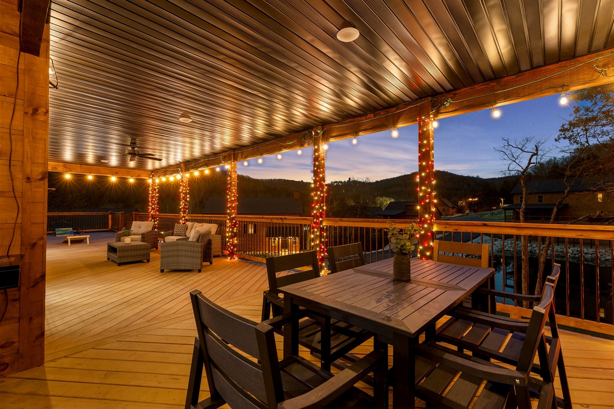 Covered deck with outdoor dining, perfect for relaxed meals.