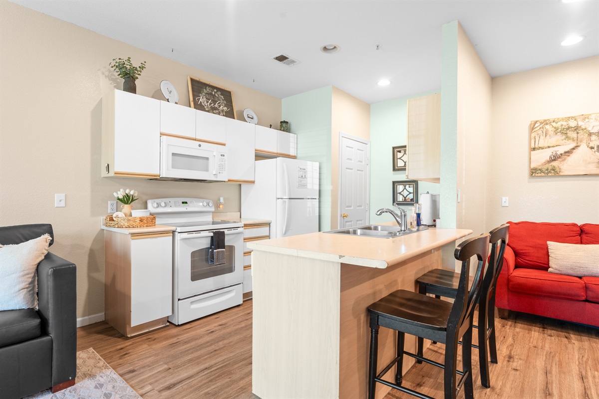 Breakfast bar and open kitchen layout keep meals, snacks, and conversation flowing easily.