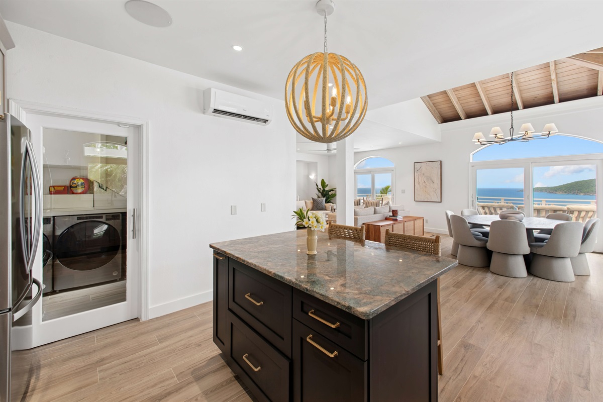 Fully stocked kitchen with stainless appliances, bar seating, coffee maker, blender, and all the tools to cook or sip in style. Enjoy free Wi-Fi throughout the villa.