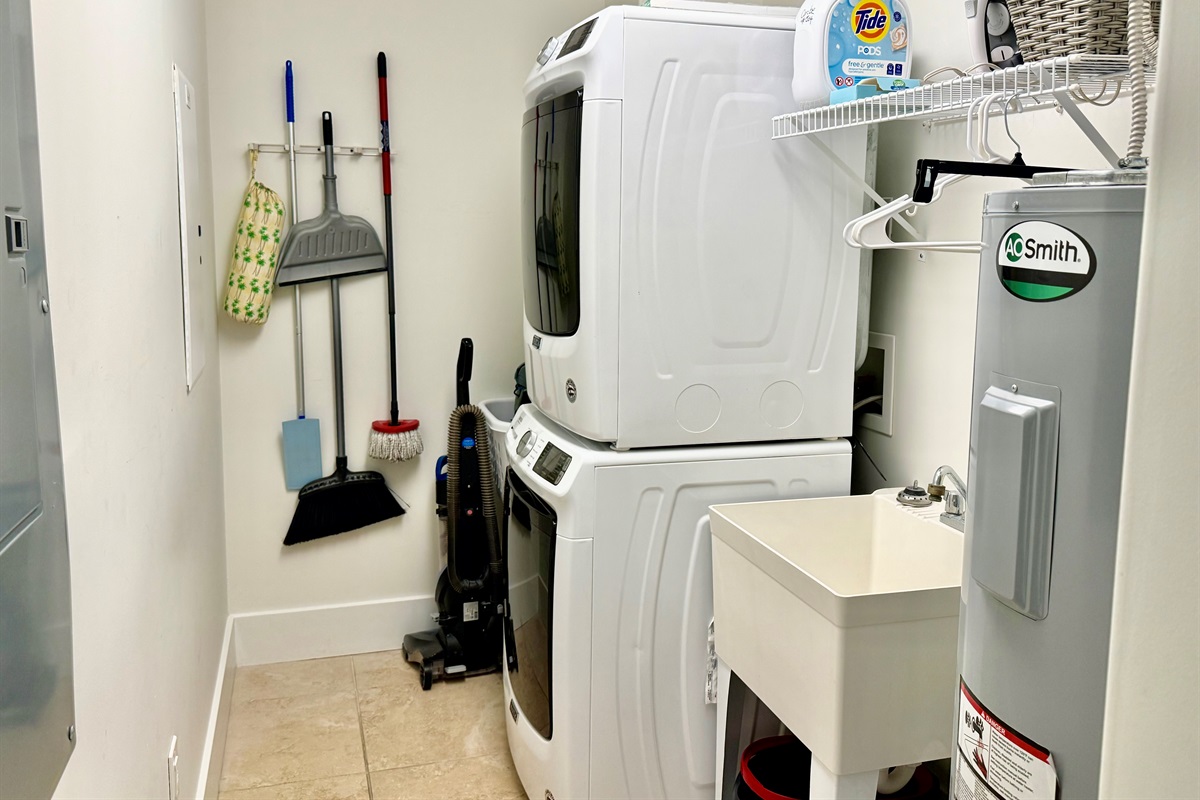 Large utility room with full sized washer and dryer..and a sink!