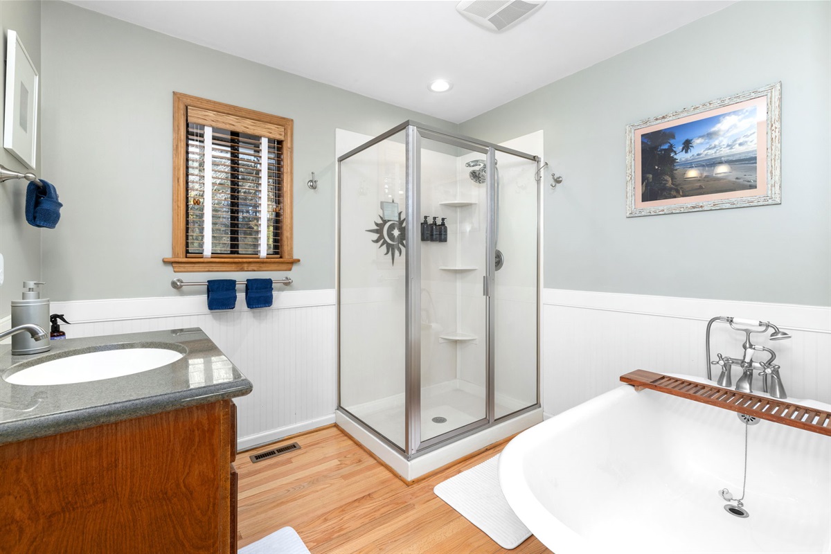 Luxurious Bathroom Retreat: Unwind in the soaking tub and invigorating rain shower!