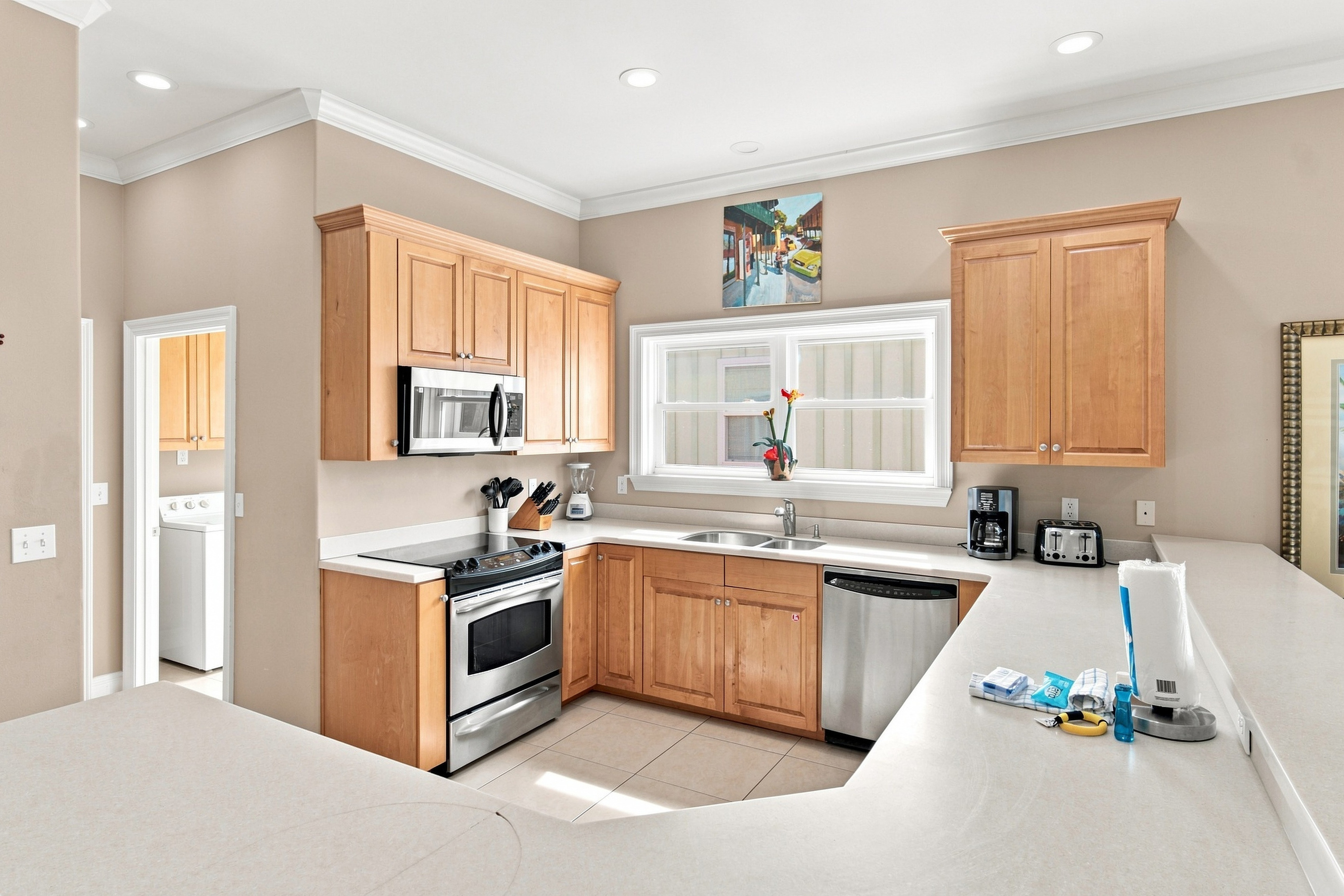 Kitchen with stainless steel range and generous prep space
