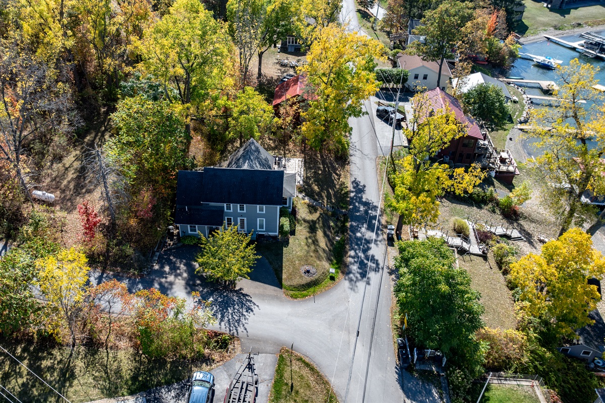 Nestled among the trees, this peaceful Finger Lakes retreat offers total privacy and lake-life vibes from above