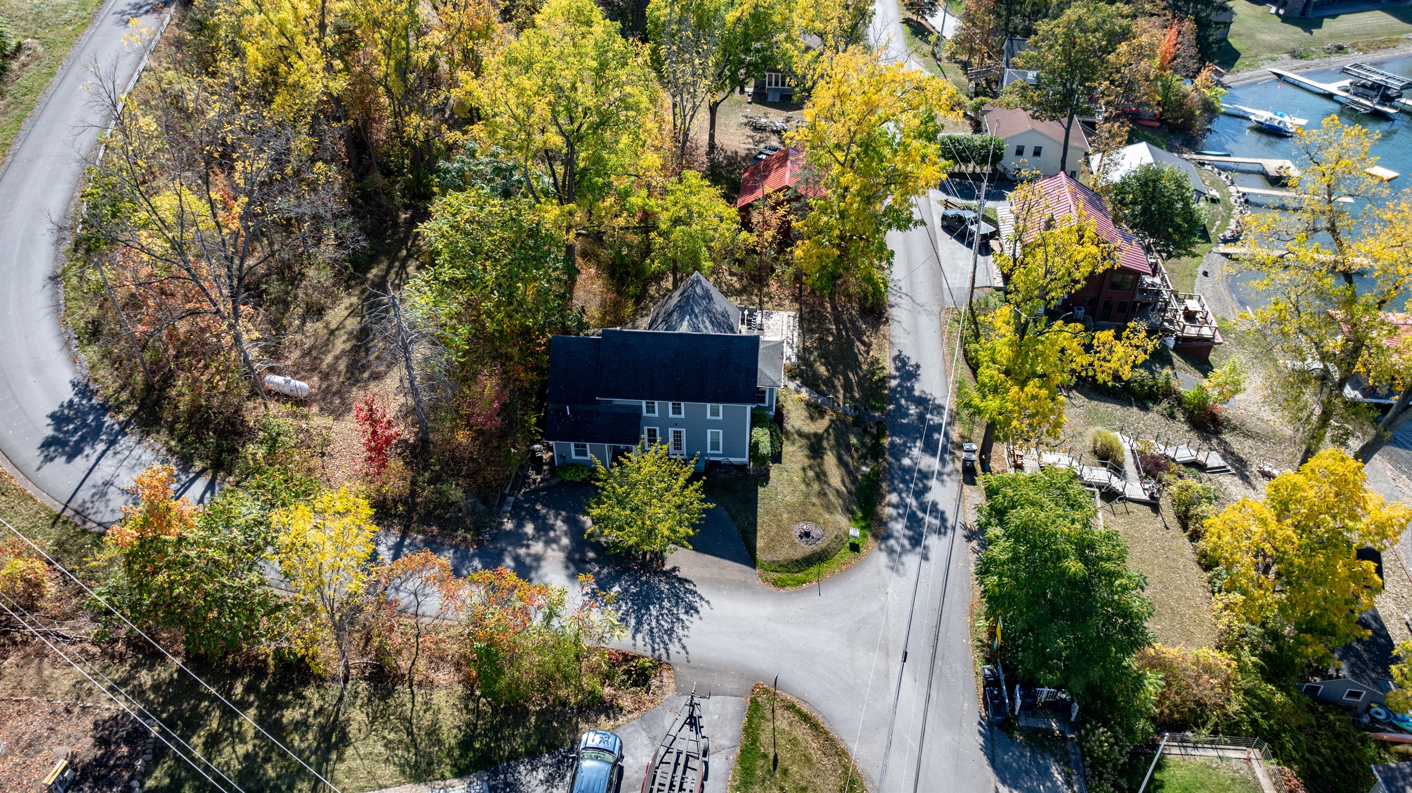 Nestled among the trees, this peaceful Finger Lakes retreat offers total privacy and lake-life vibes from above