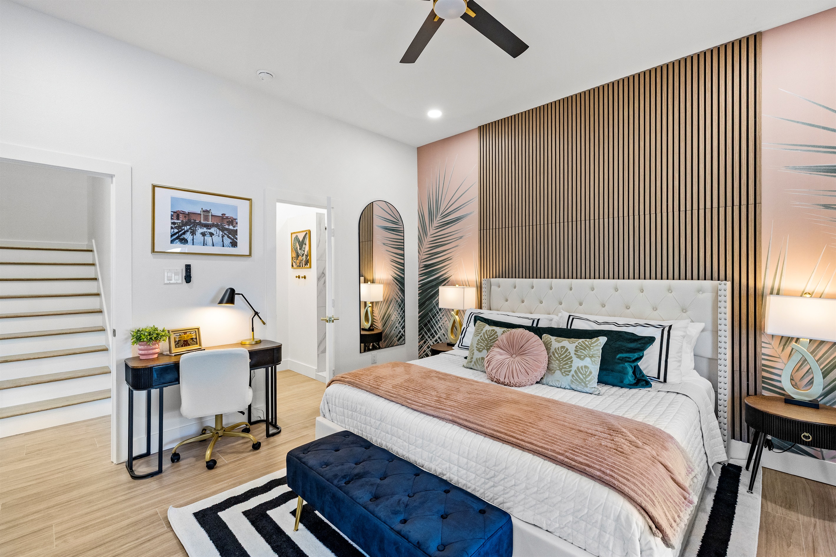 Enjoy luxurious bedding in the Palms of Grand Galvez Primary Suite.