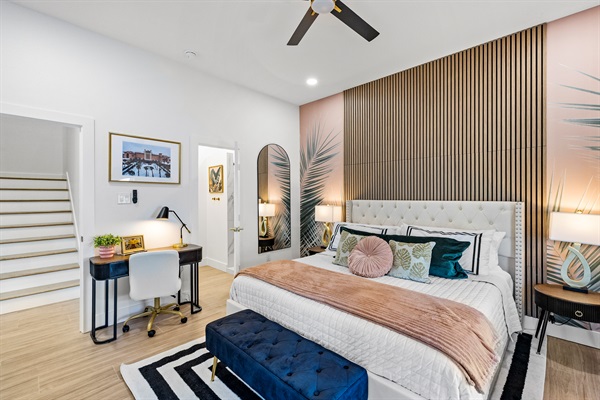 Enjoy luxurious bedding in the Palms of Grand Galvez Primary Suite.