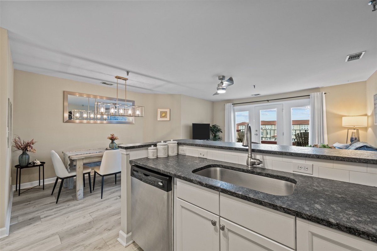 Open kitchen overlooking the dining and living areas&mdash;perfect for staying connected with family and friends while cooking