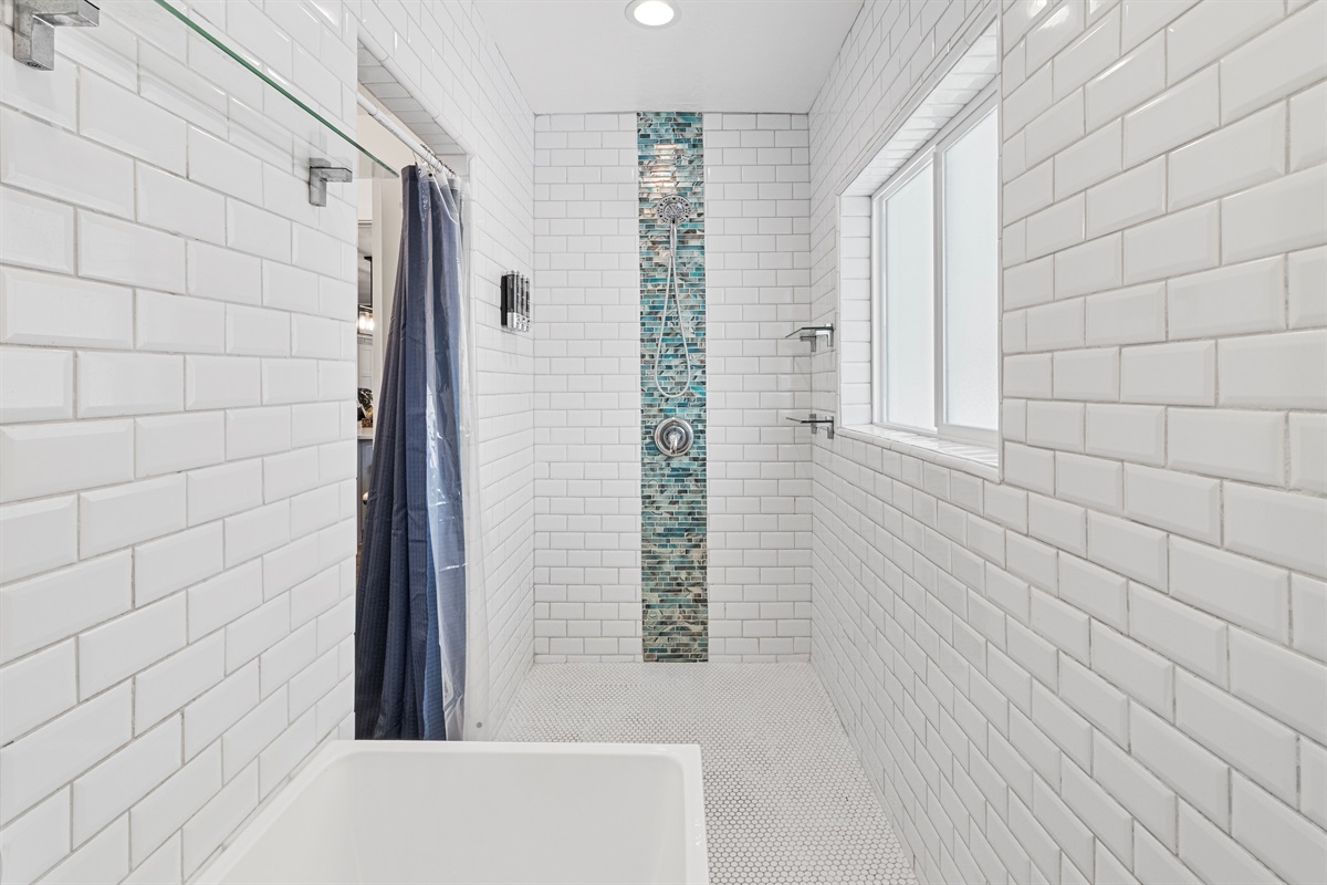 Custom designed bathroom with little kids in mind. Walk in shower and full size tub inside a wet room.