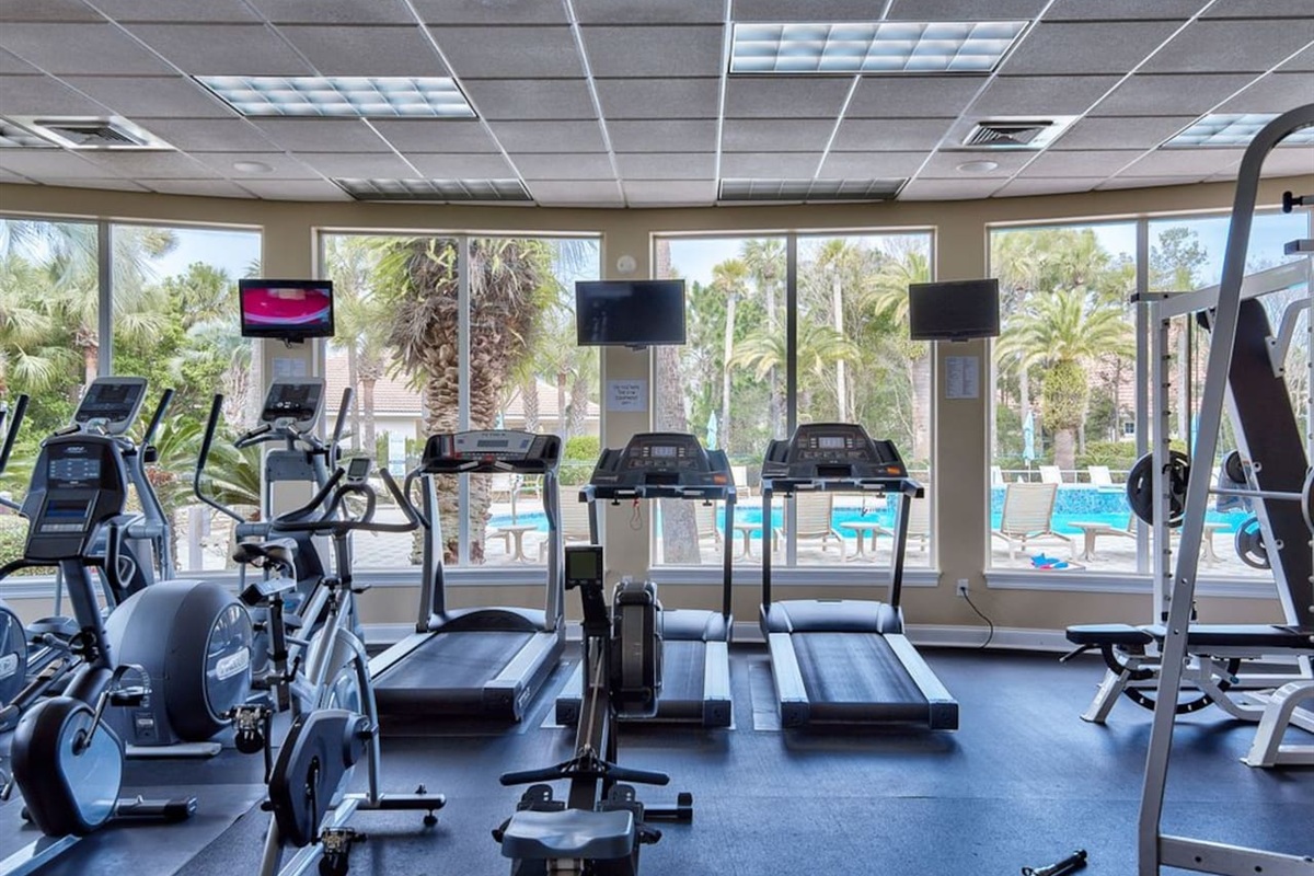 Clubhouse gym overlooking the pool, fully equipped