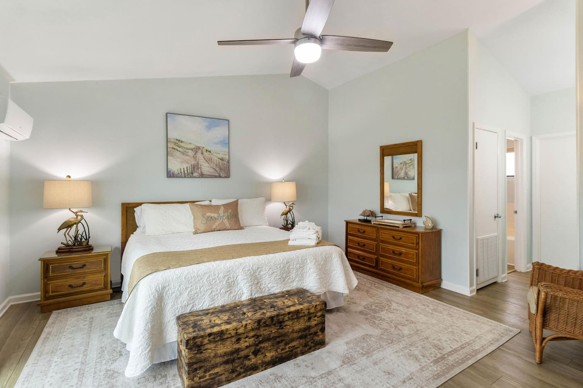 Claim the king master suite &mdash; private deck through those doors, soaking tub down the hall, Gulf turning gold by evening.
