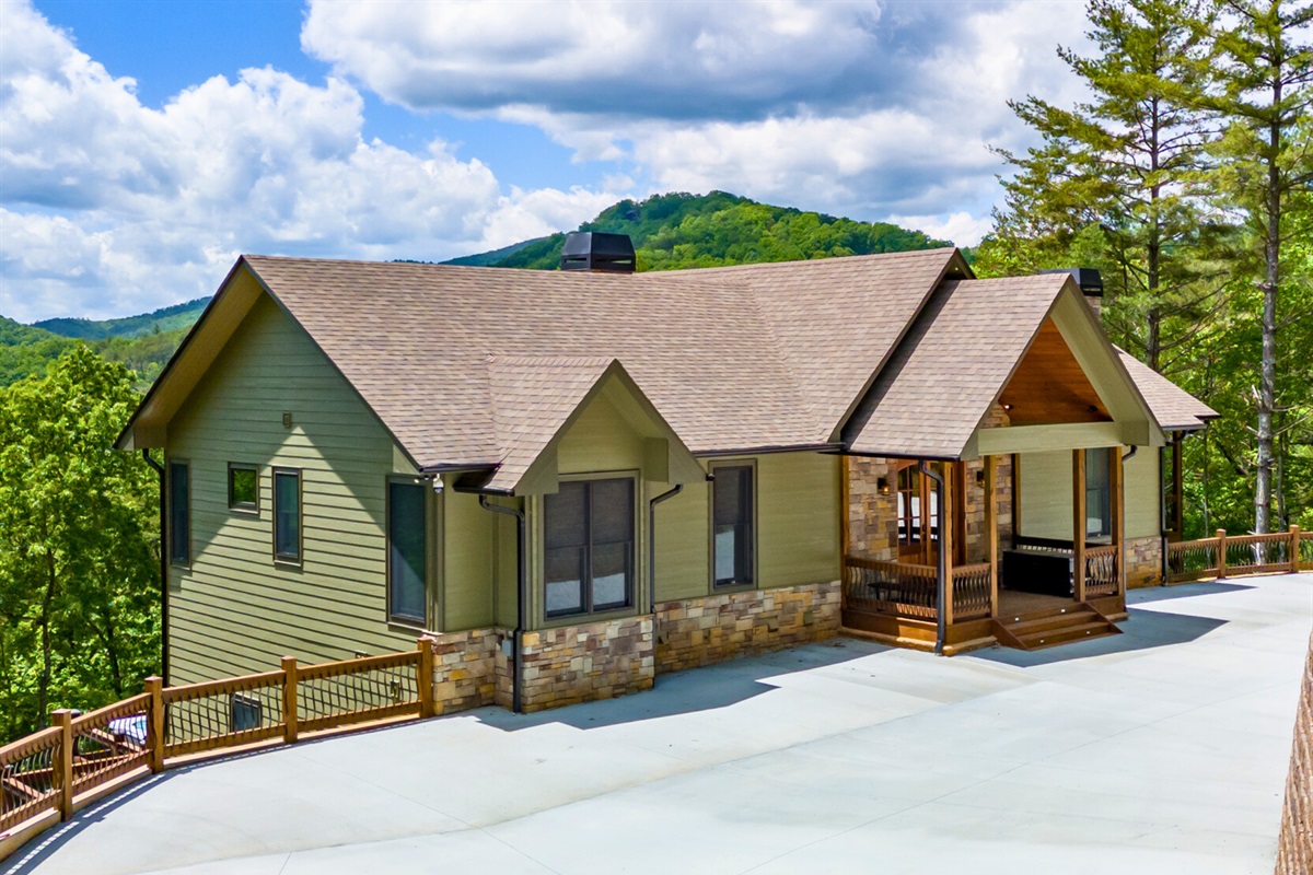 A welcoming front view of the chalet, complete with ample parking and a charming entrance.