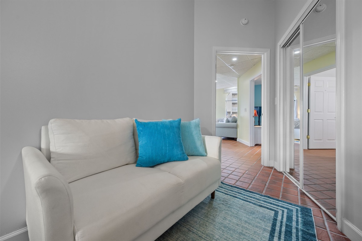 Lounge seating tucked beside the bedroom