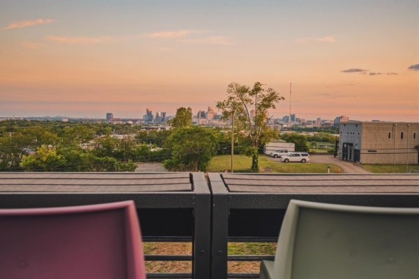 PARTIALLY COVER ROOFTOP WITH TV AND PLENTY OF SEATING TO ENJOY THE VIEWS.