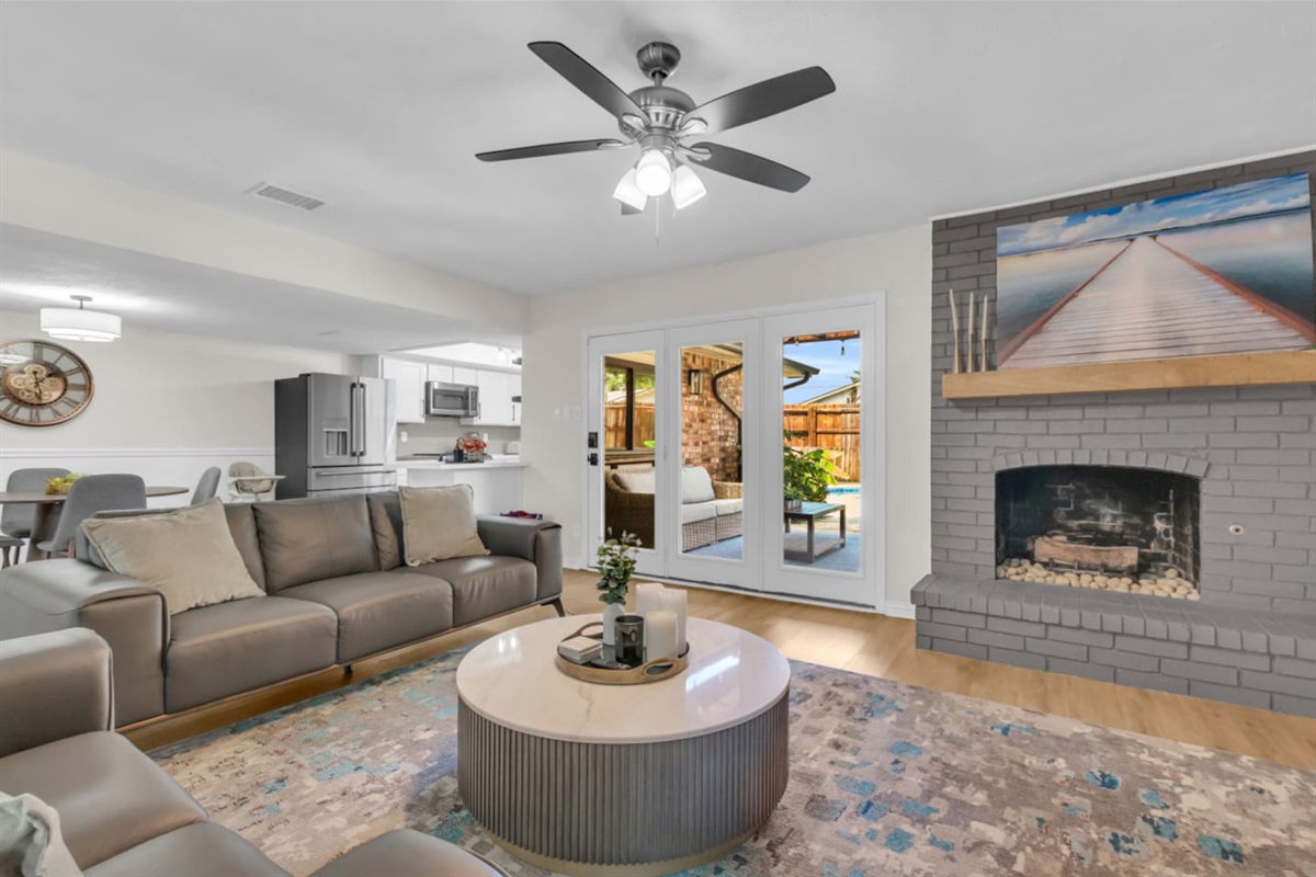 Relax in a spacious living room with ample seating and a large smart TV for movie nights