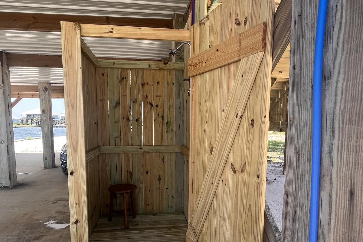 Refresh and rinse off after a day at the beach in our private outdoor shower, featuring both hot and cold water for your comfort.