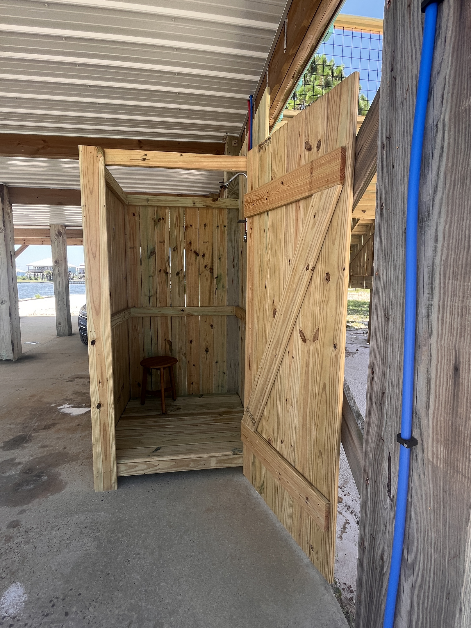 Refresh and rinse off after a day at the beach in our private outdoor shower, featuring both hot and cold water for your comfort.