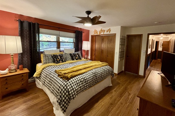 King Bed, Ceiling Fan, Closet with Luggage Rack, door to Master Bath