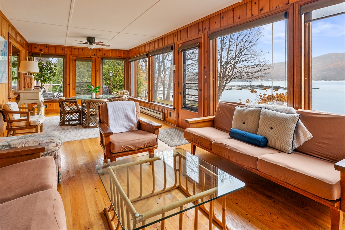 Cozy sun room for morning coffee or evening wine with beautiful views of the lake